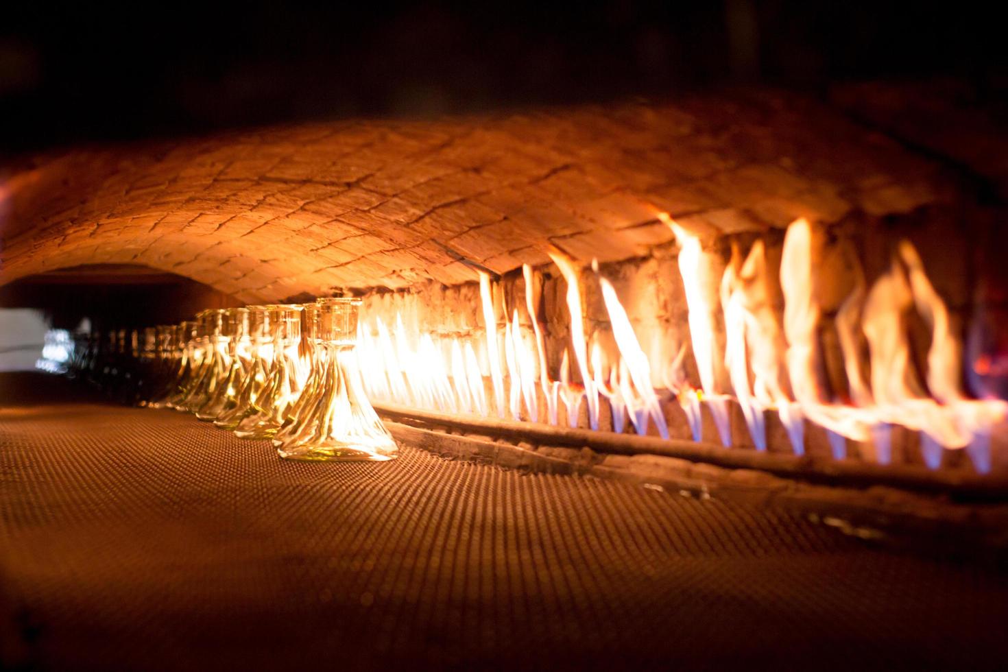 Glassworks glass manufacturing, process of forming a decorative vase photo