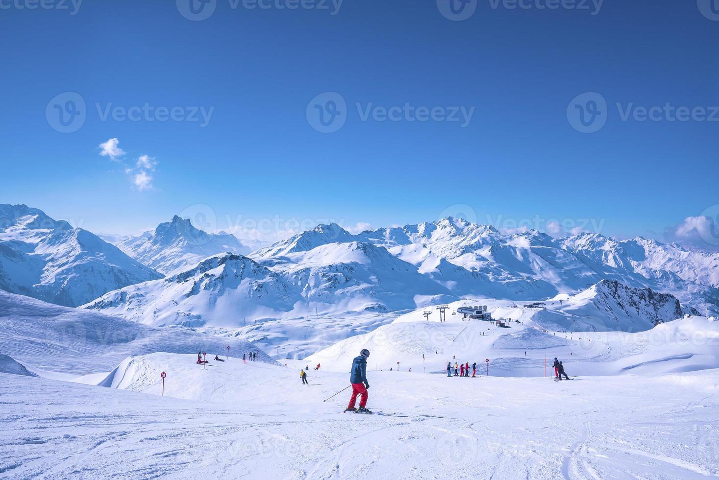 Premium Photo  Young snowboarder sliding down snowy slope on mountain at  winter resort