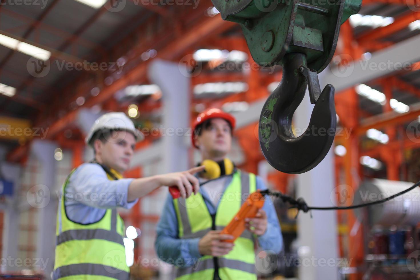 Industry worker Foreman or worker work at factory site check up machine or products in site. Engineer or Technician checking Material or Machine on Plant. Industrial and Factory. photo