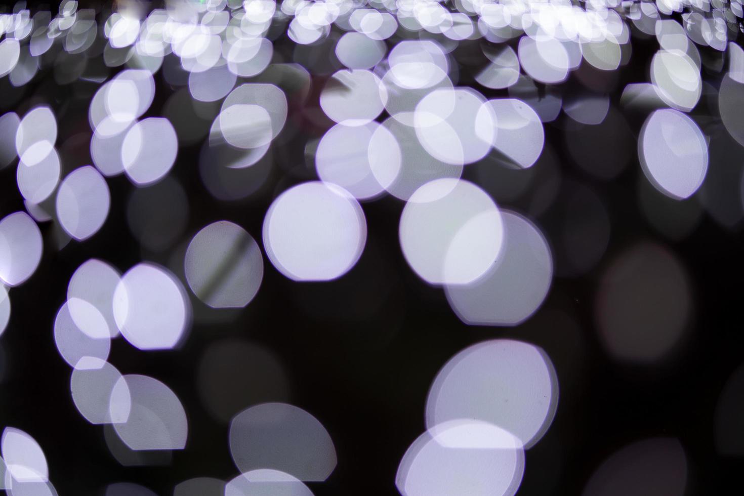 Fondo de bokeh de luz de Navidad borrosa abstracta. foto