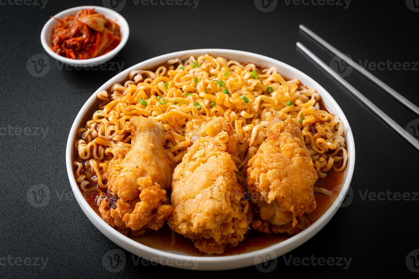 Korean instant noodles with fried chicken or Fried chicken ramyeon photo