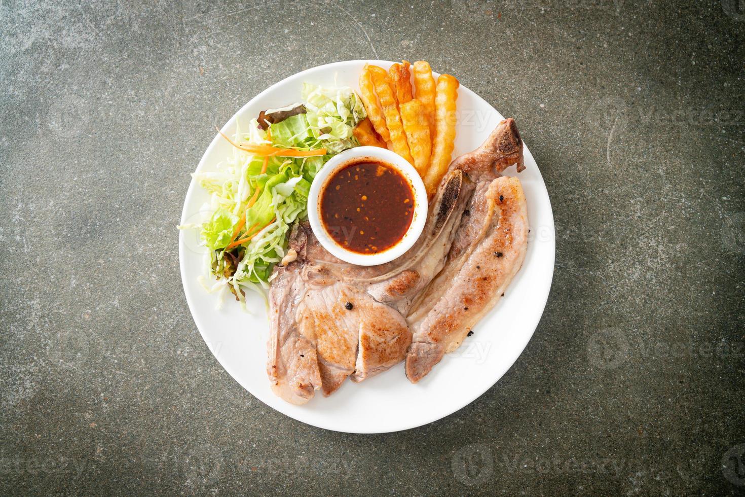 grilled pork chop steak with Thai spicy dipping sauce photo