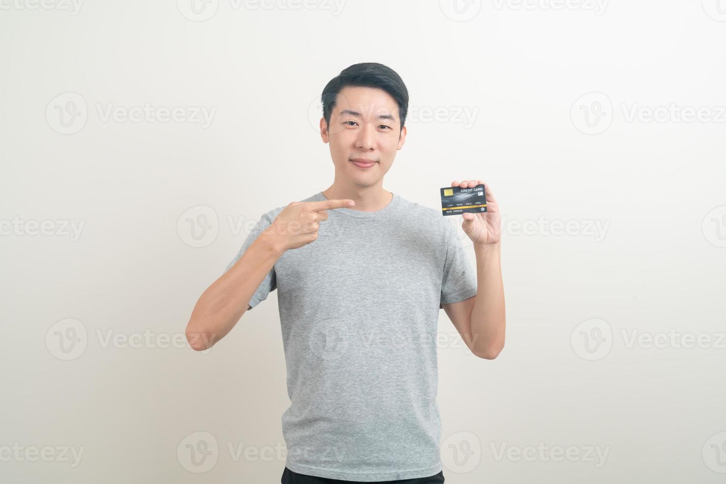 young Asian man holding credit card photo