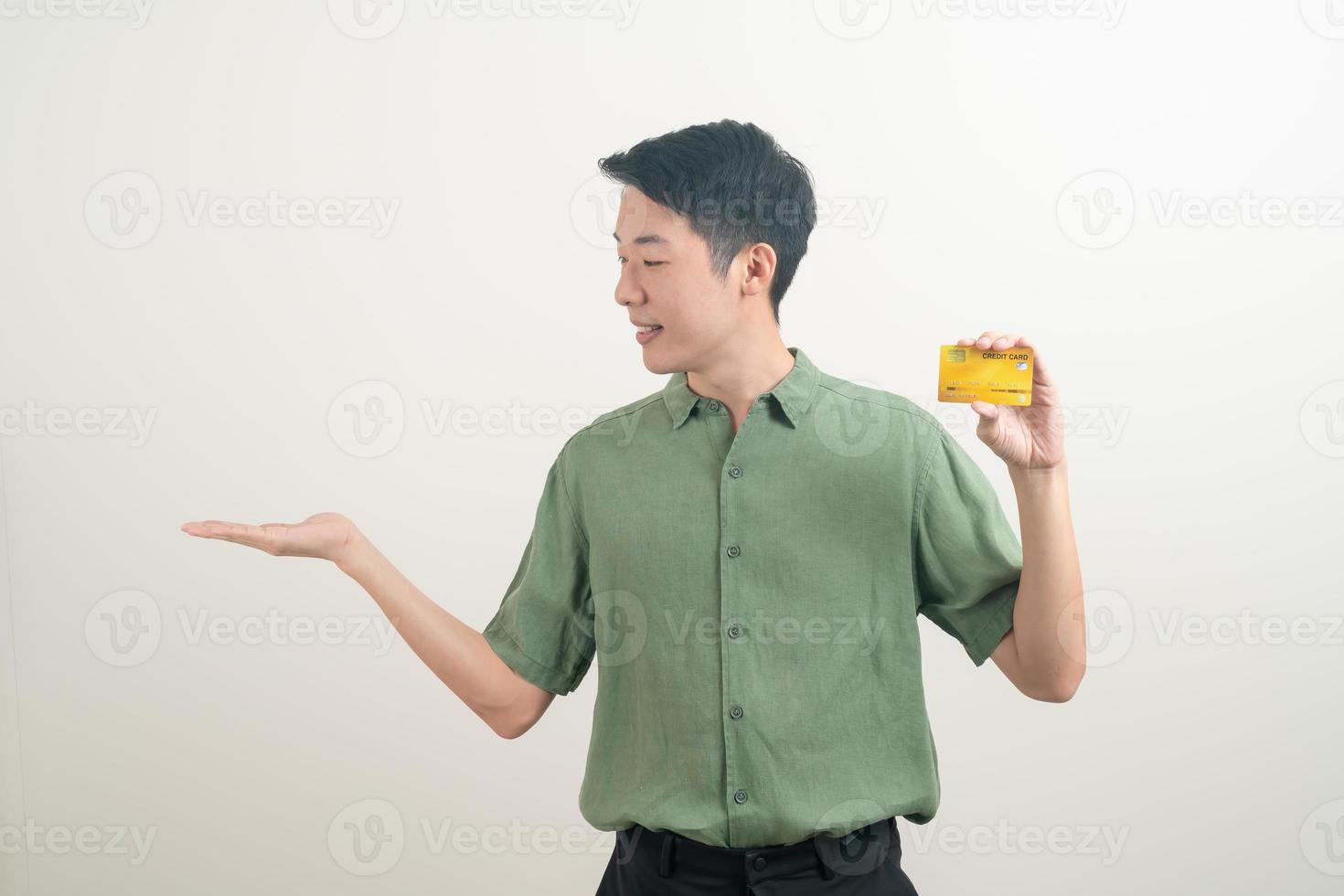 young Asian man holding credit card photo