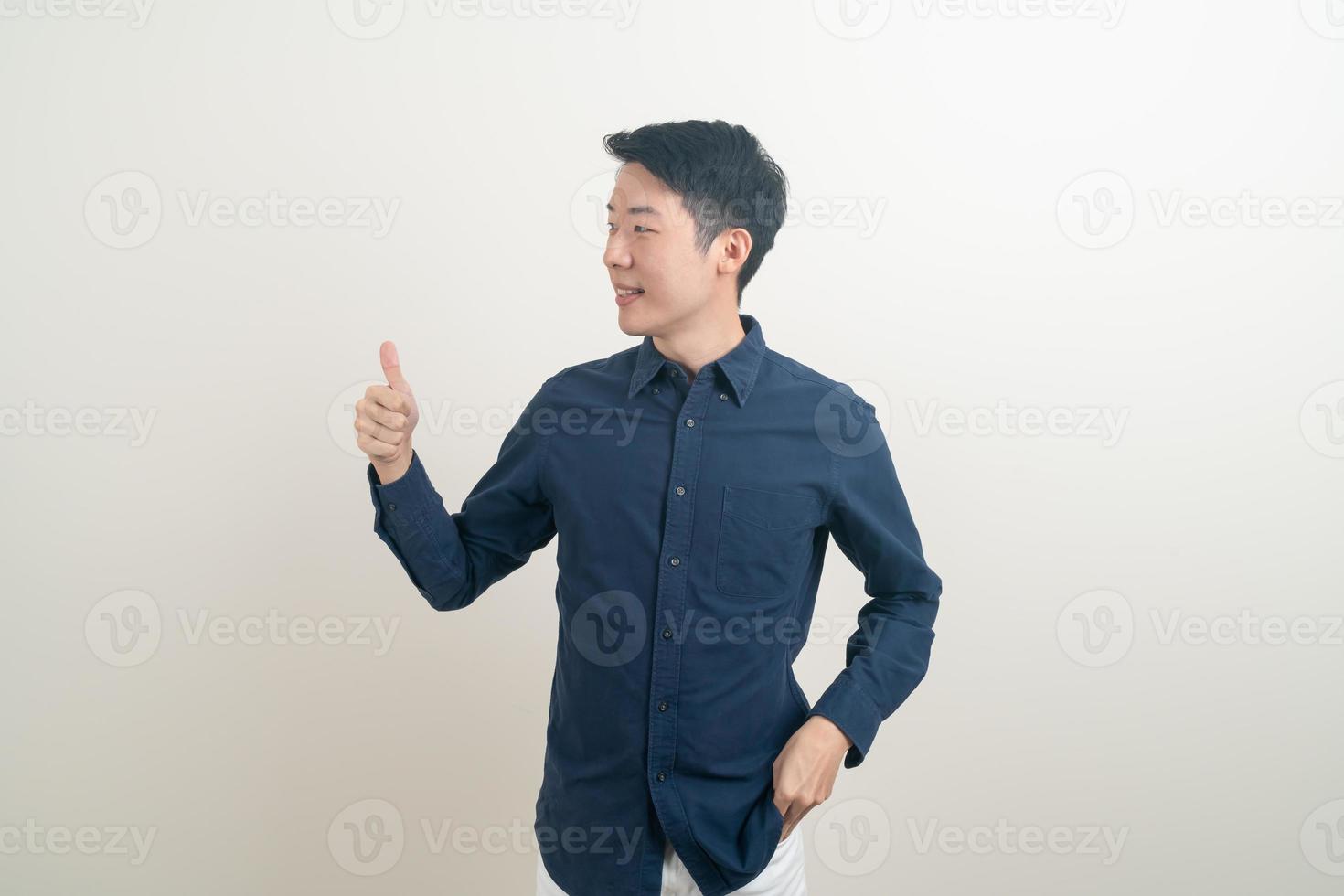 young Asian man thumbs up or ok hand sign photo