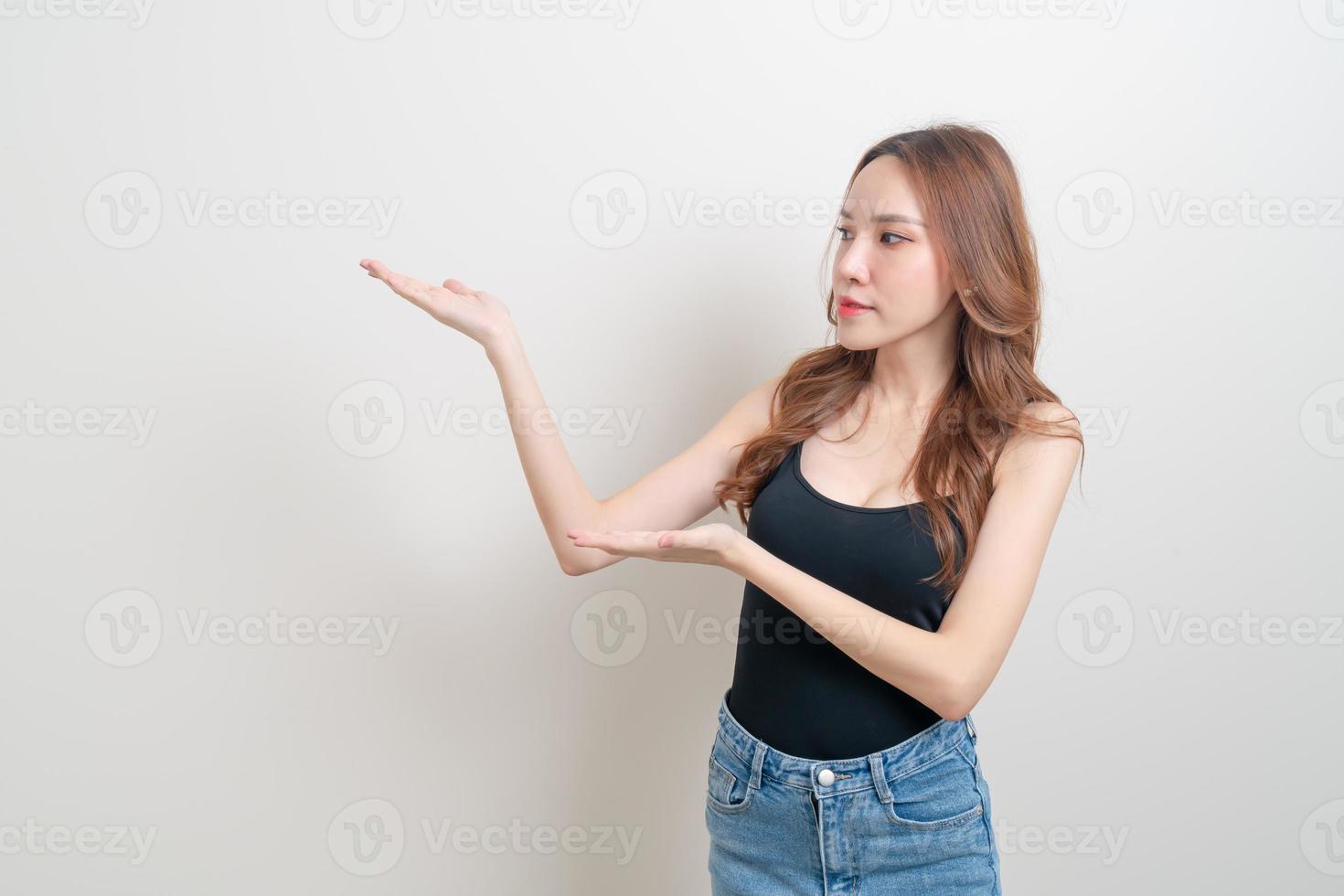portrait beautiful woman with hand presenting or pointing photo