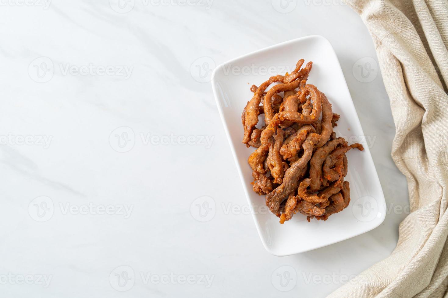 Sun-Dried Pork on white plate photo