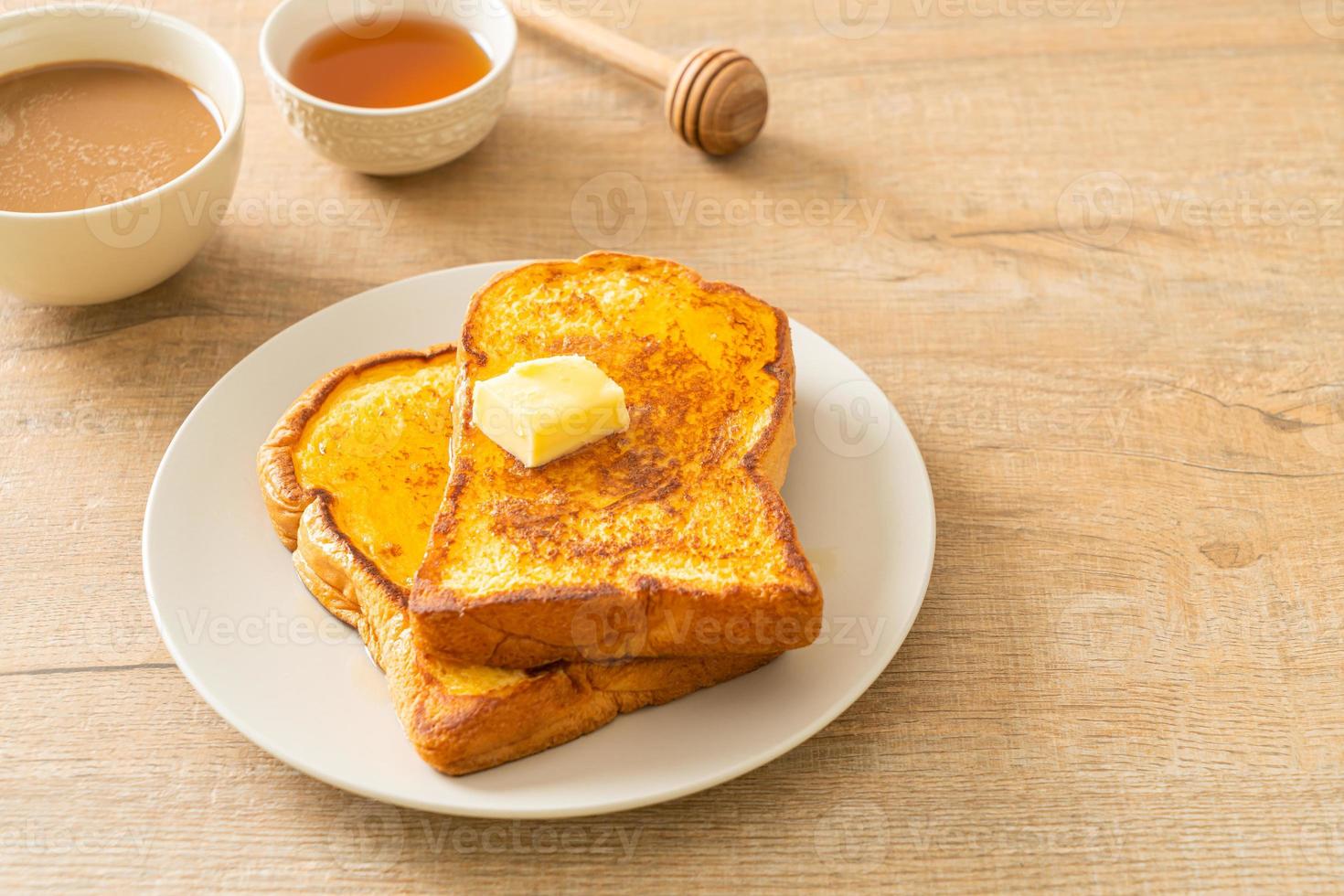 French toasted with butter and honey photo