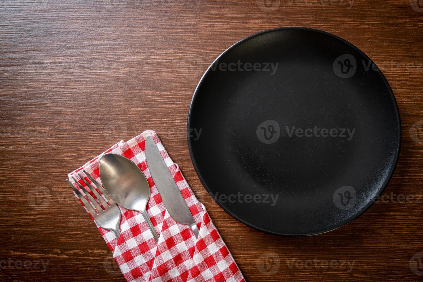 empty plate or dish with knife, fork and spoon photo