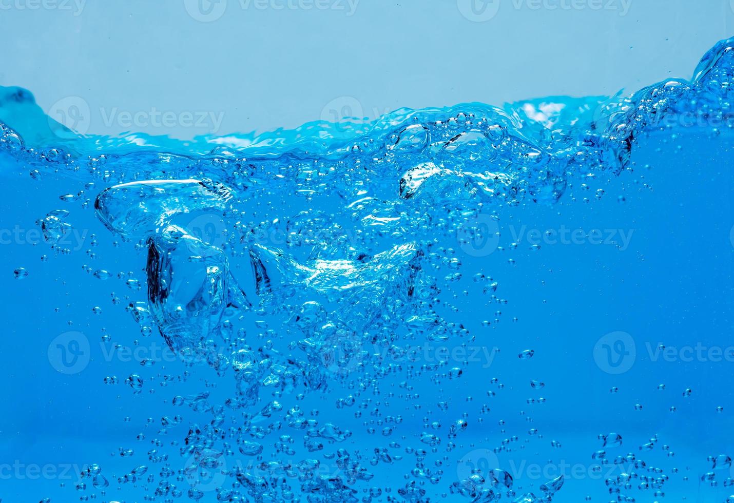 Water and air bubbles over white background with space for text photo