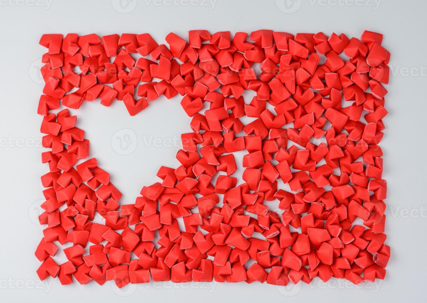 Paper heart arrangement on white table photo