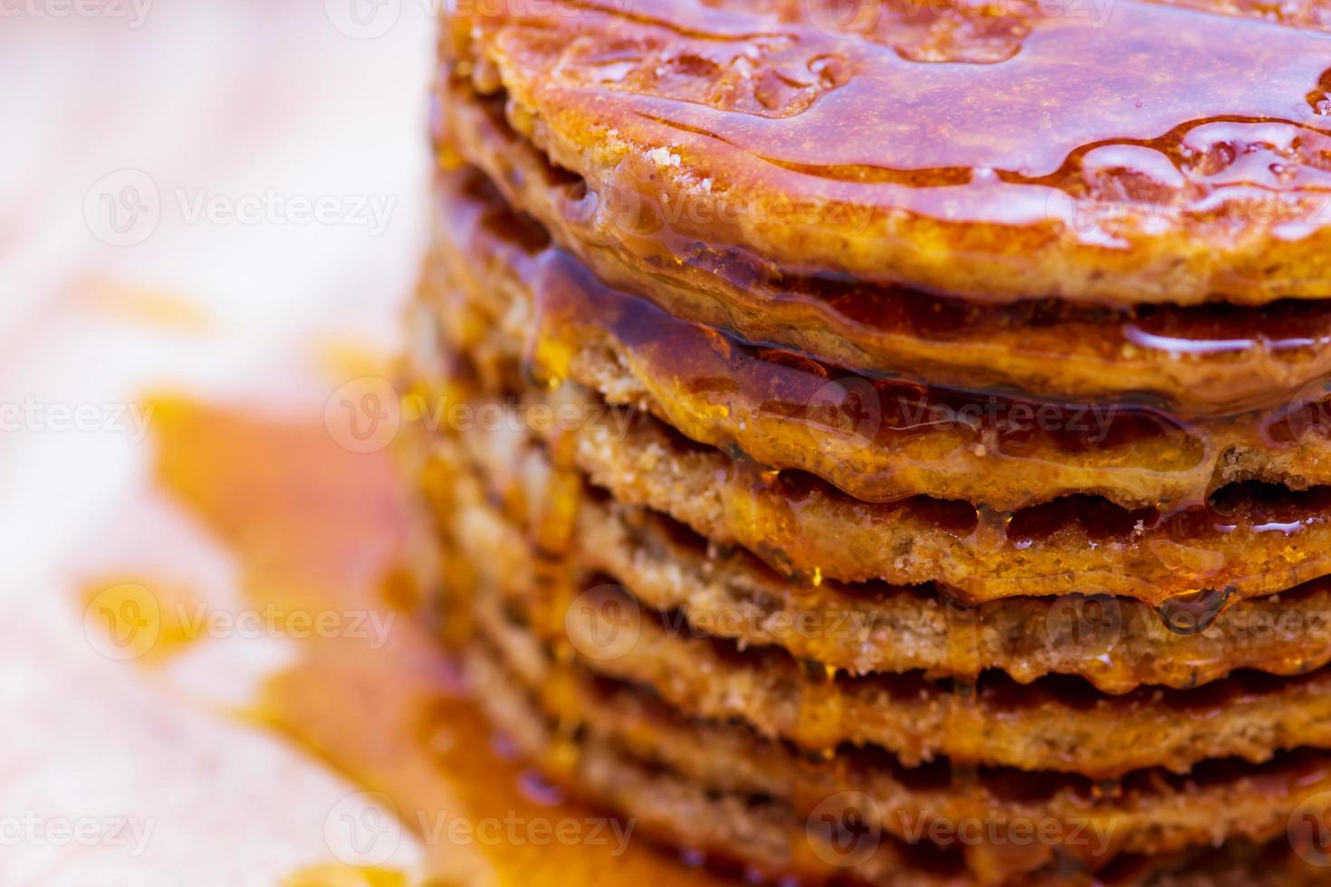 Wafer sprinkled with honey on wooden tray ready to serve photo