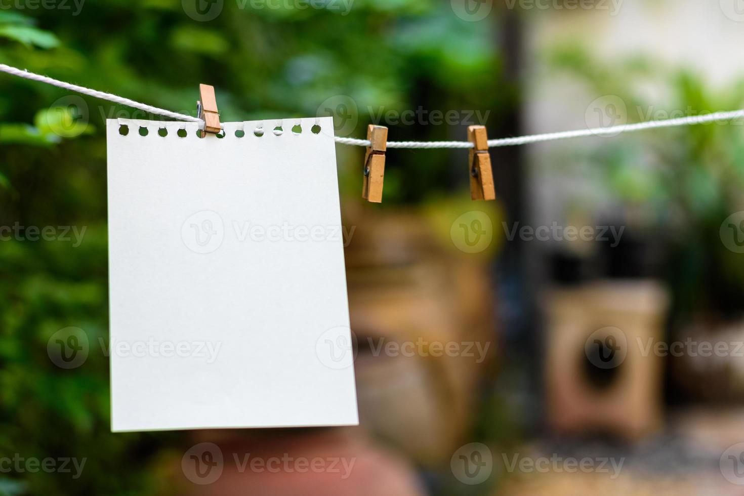Close up wood paper clip for hanging notes. photo