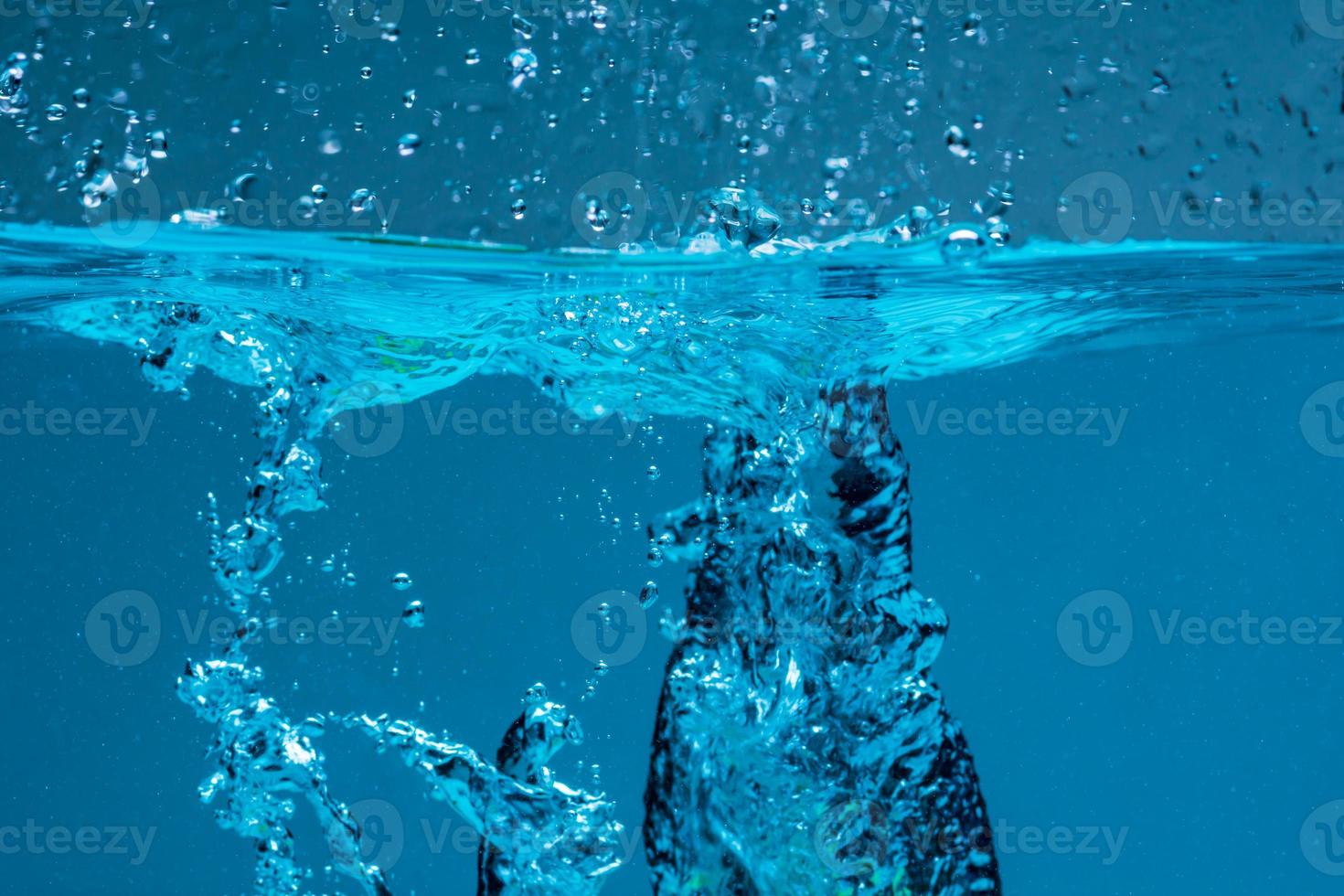 Surface of blue water against white background photo