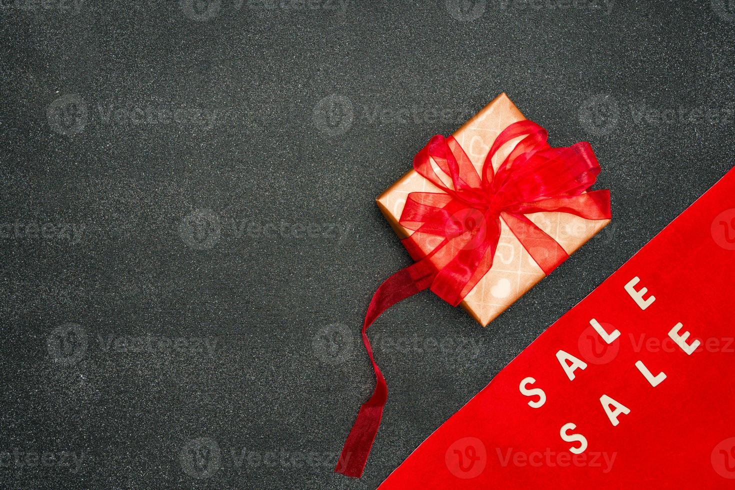 Sign with sale, Shopping and sales concept. Advertising message in black background. photo