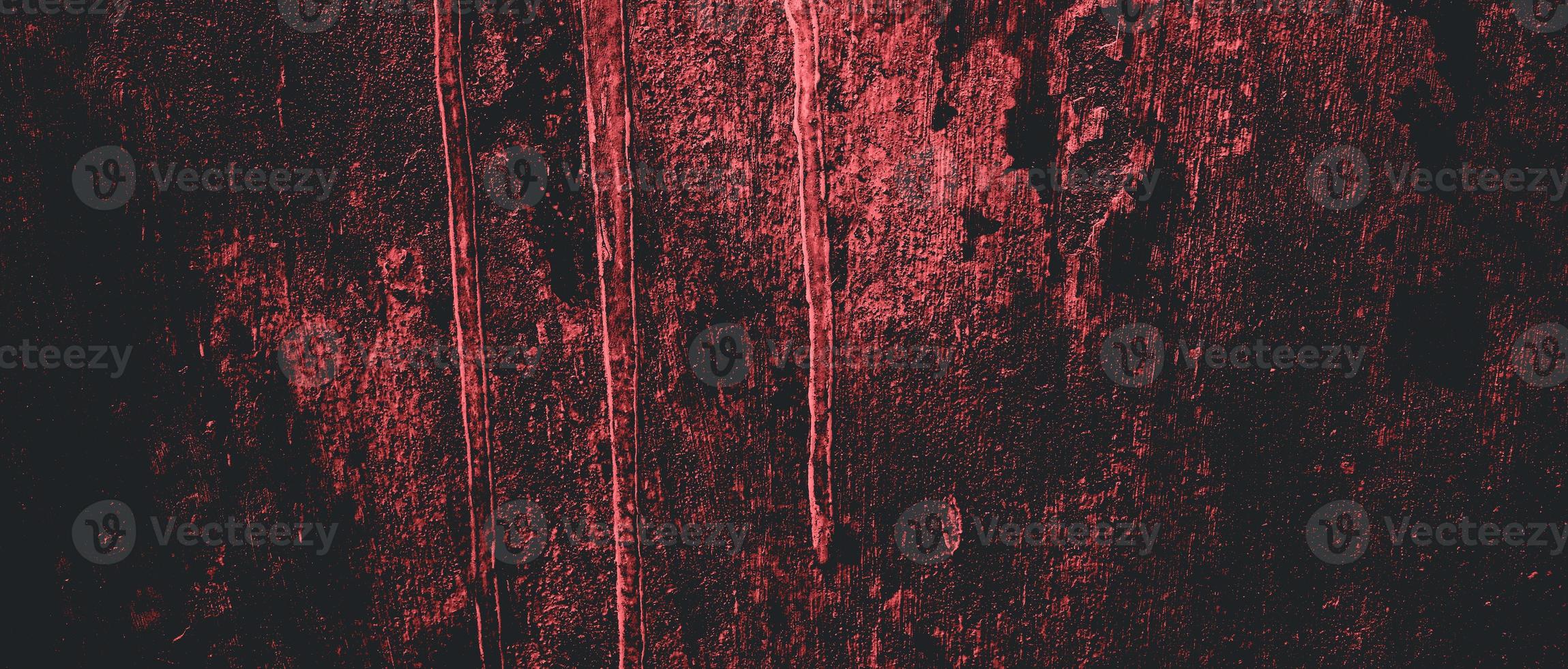Wall full of scratches. Grungy cement texture for background, Scary dark wall.Black wall photo