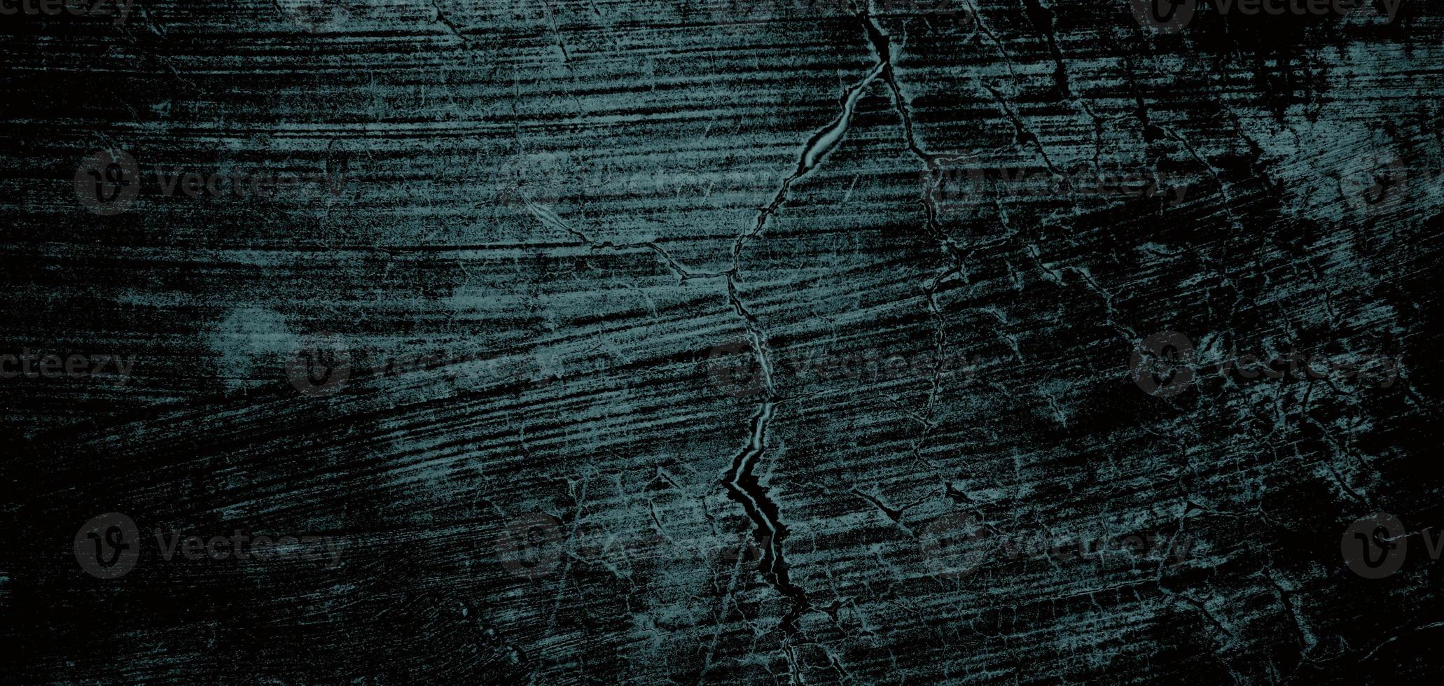 Wall full of scratches. Grungy cement texture for background, Scary dark wall.Black wall photo