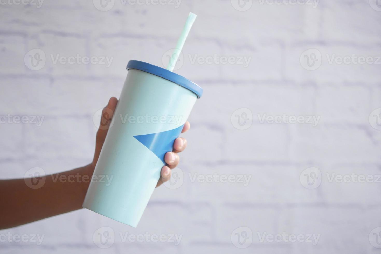 holding a reusable eco coffee cup with copy space. photo
