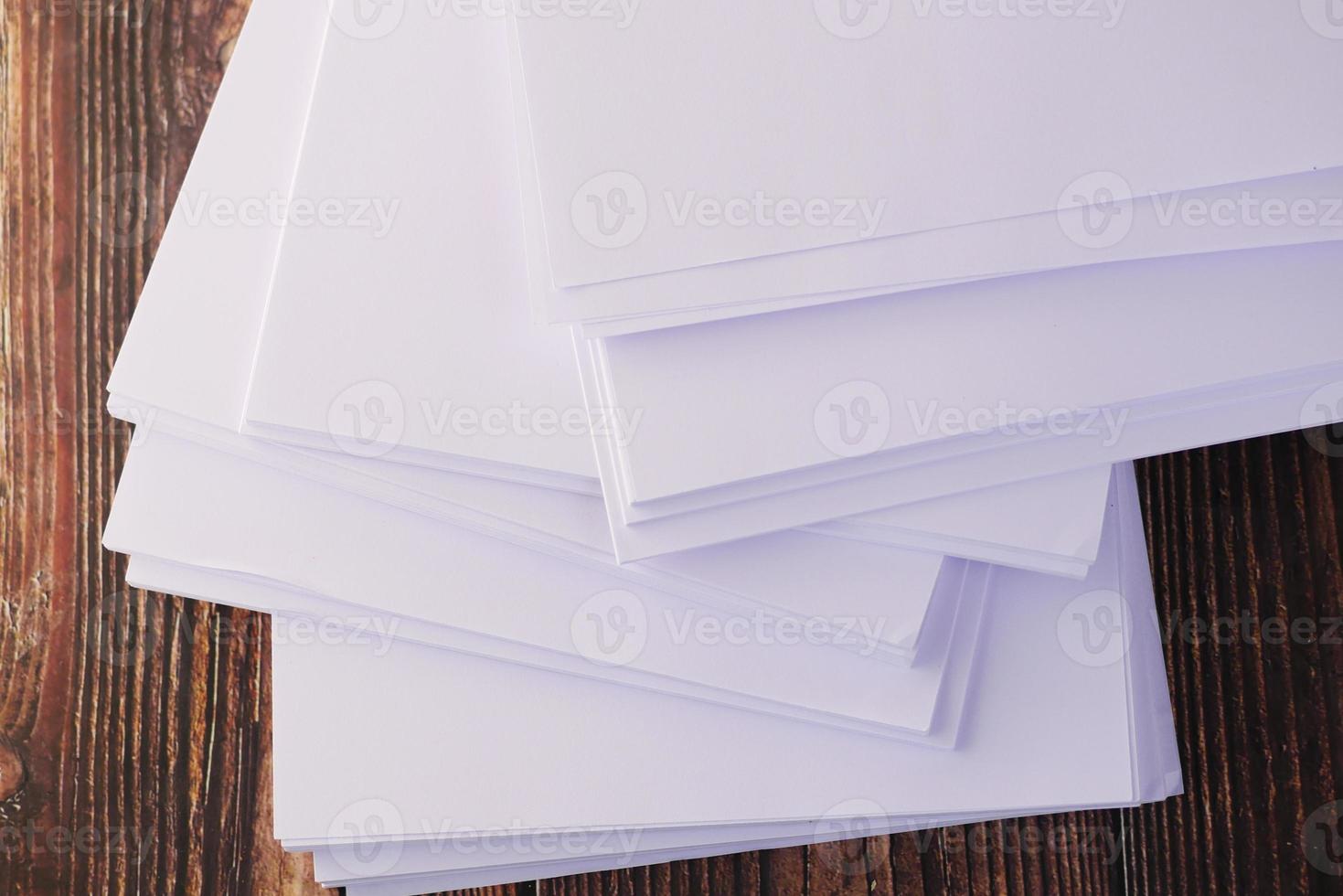 close up of stack of empty paper on table photo