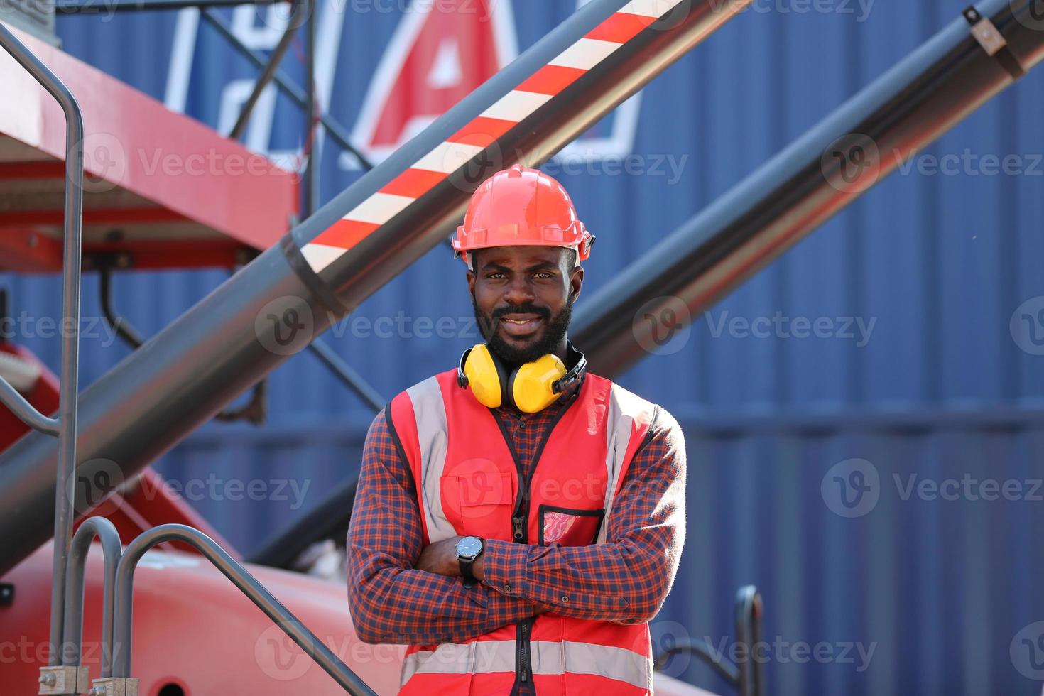 Foreman control loading Containers box from Cargo freight ship for import export. photo