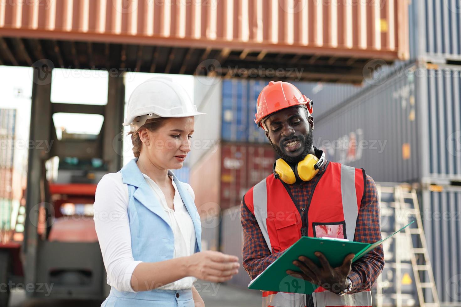 foreman checking containers in the terminal, at import and export business logistic company. photo