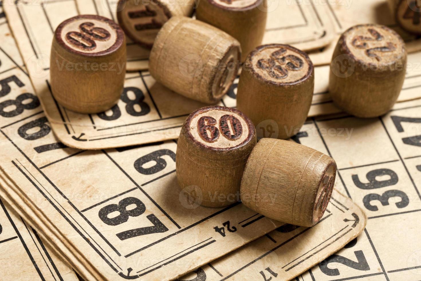 Table game Bingo. Wooden Lotto barrels with bag, playing cards for Lotto card game, leisure, play, strategy, gambling, lottery, photo