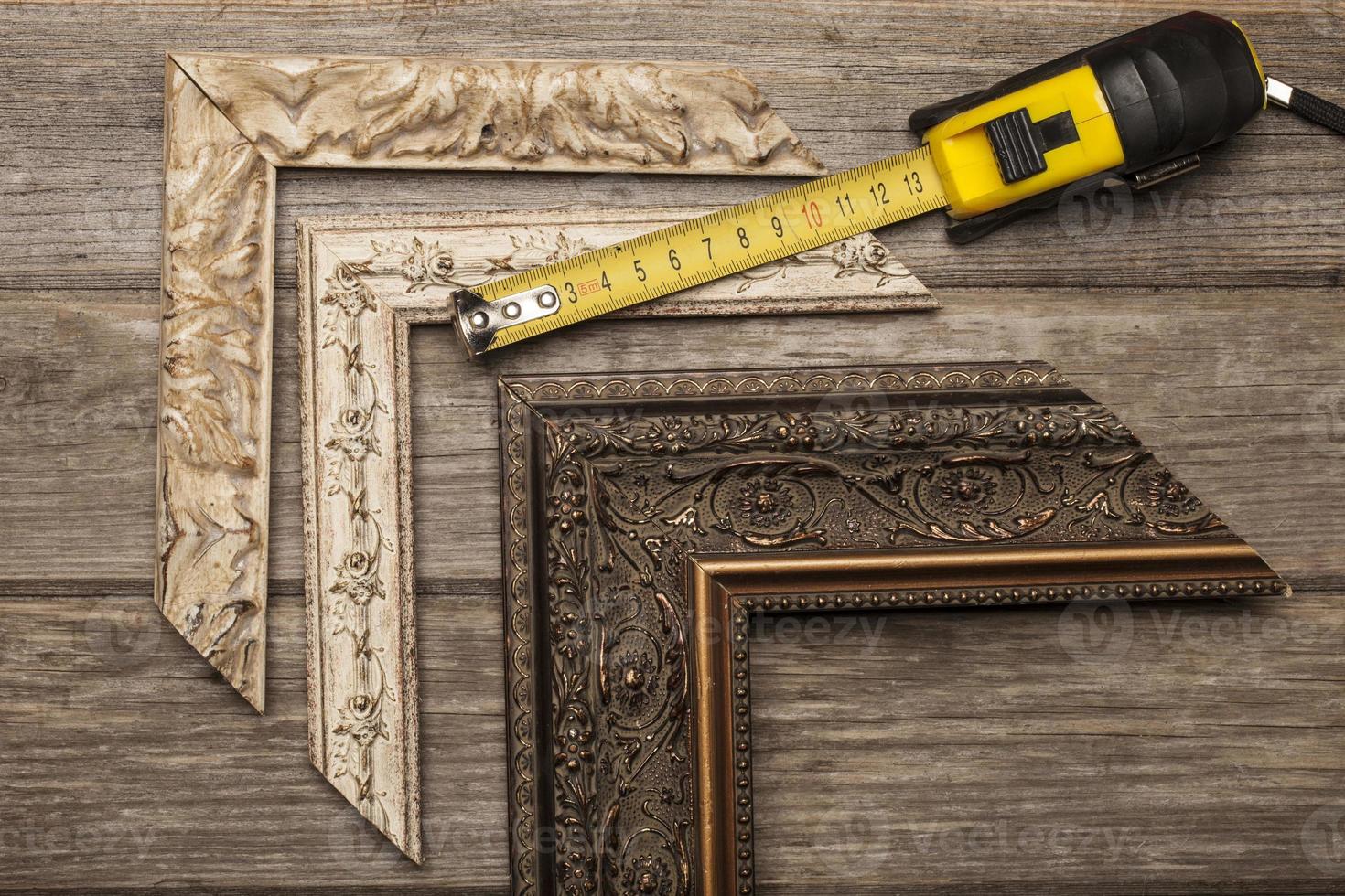 Frame and measuring tool samples on grey boards photo