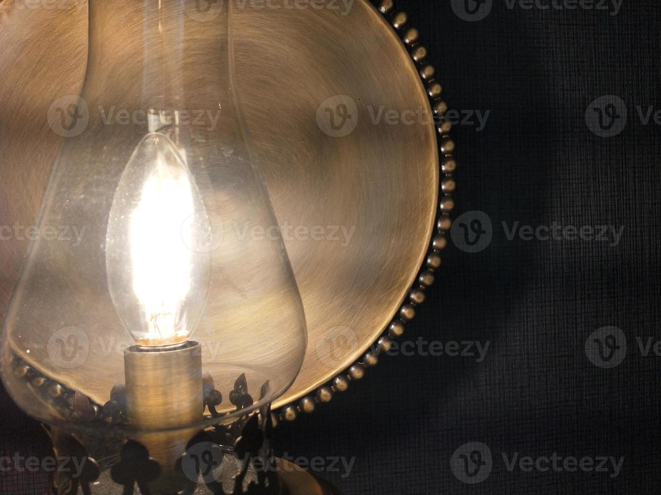 background photo of yellow lantern lamp covered in shadow