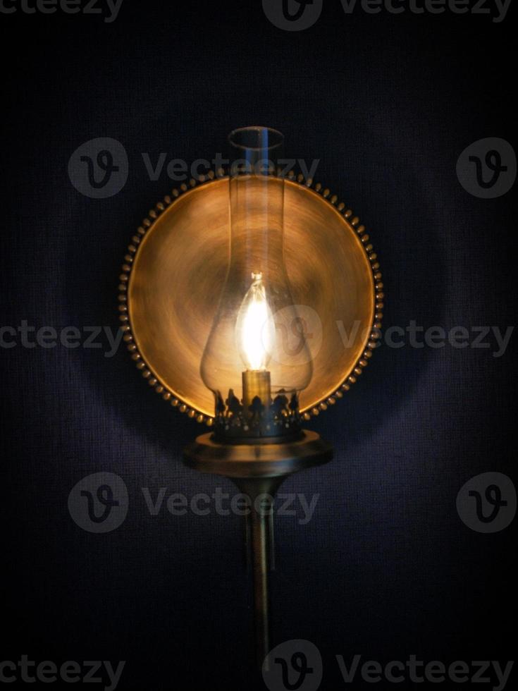 background photo of yellow lantern lamp covered in shadow