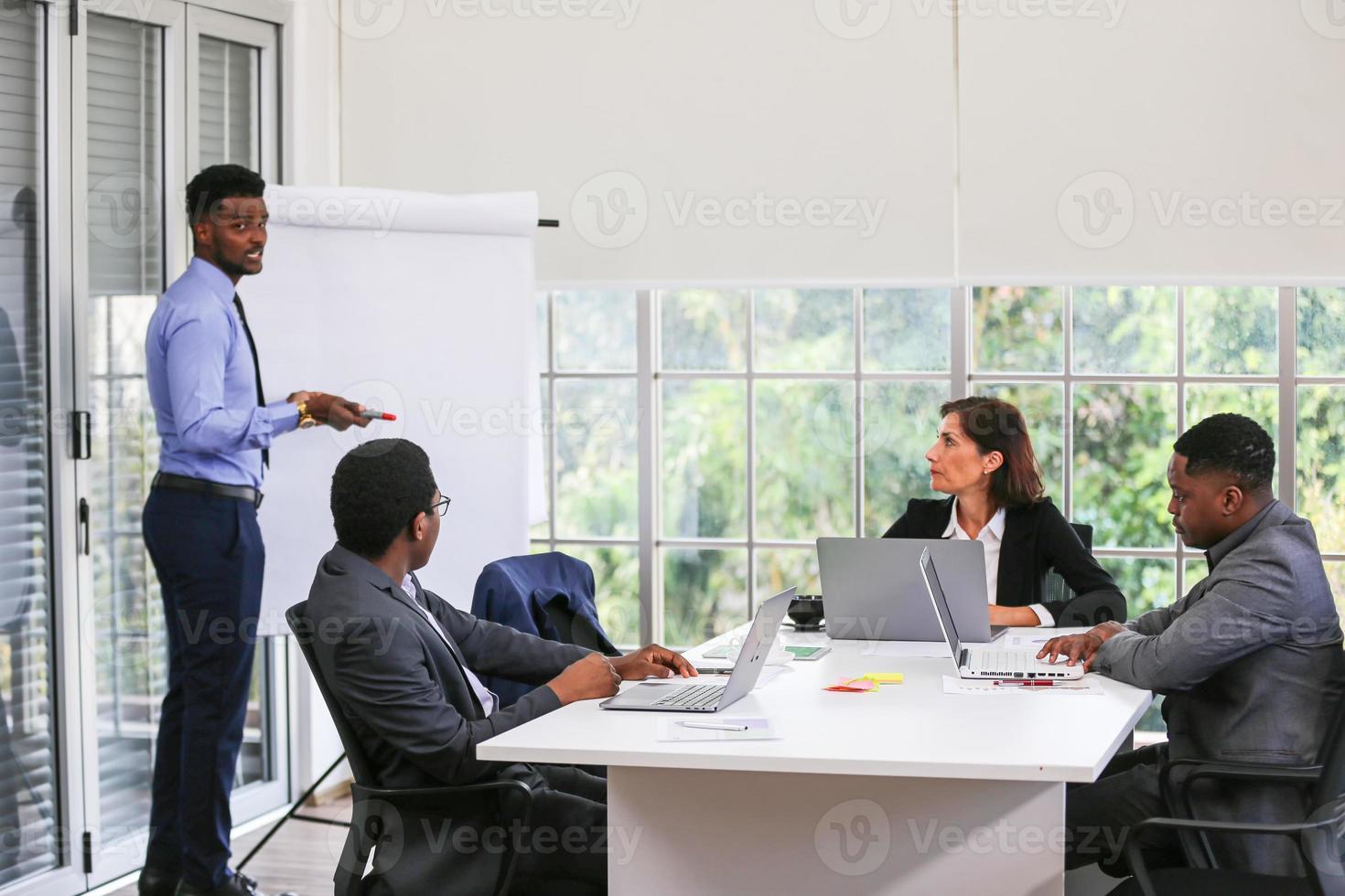 Young start-up business team working in meeting room. photo