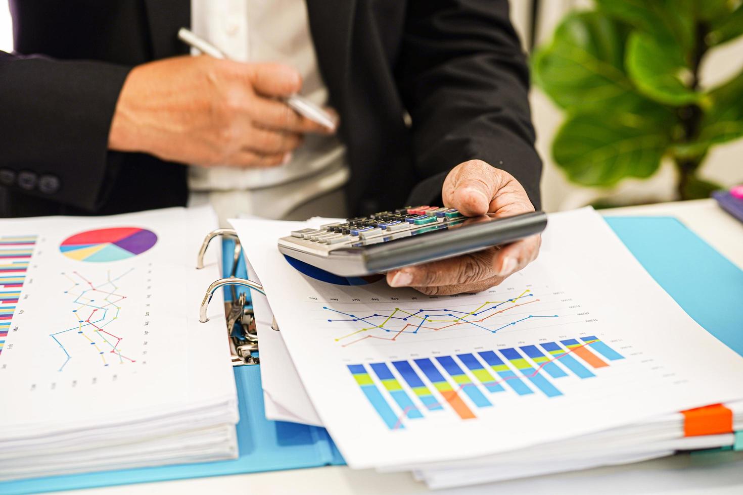 Businessman working and analysis with statistic graph in office. photo
