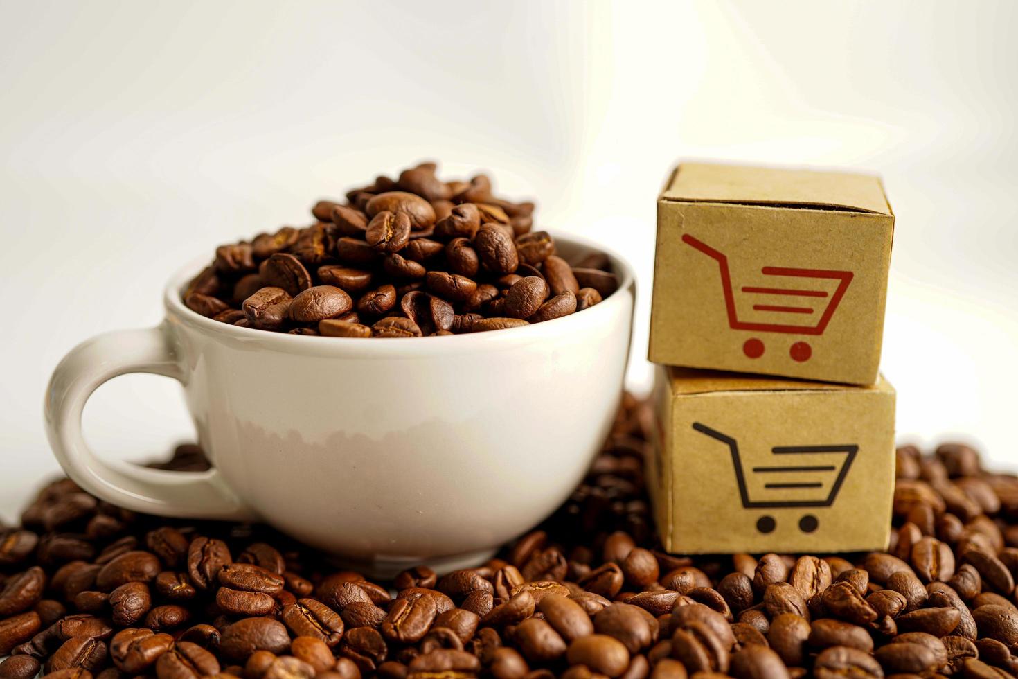 Shopping cart box on coffee beans, shopping online for export or import. photo