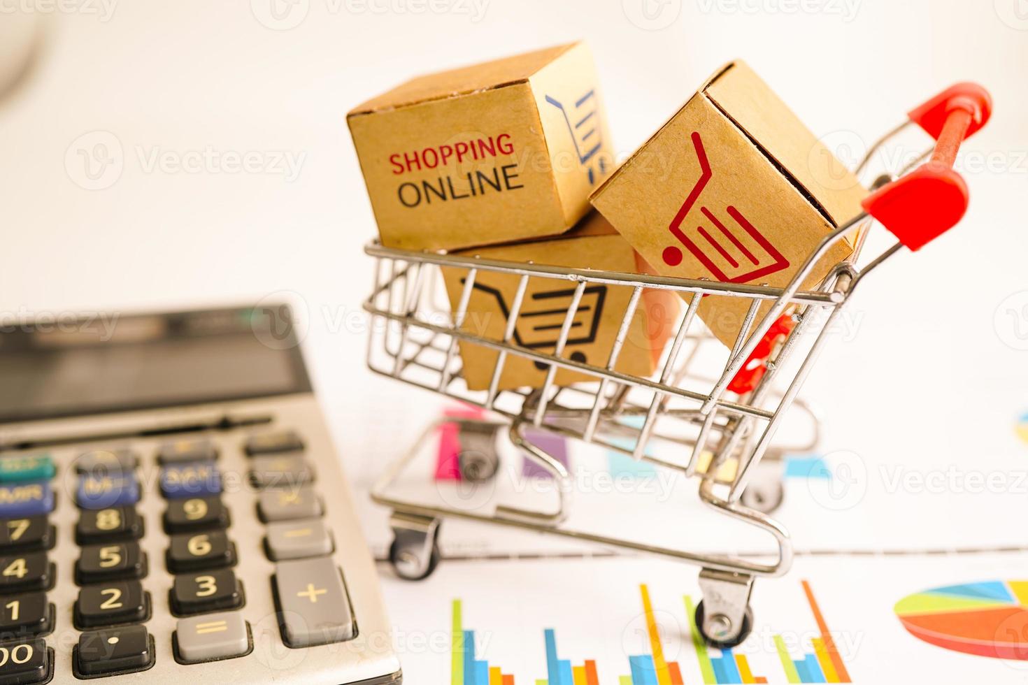 Online shopping, Shopping cart box on business graph, import export, finance commerce. photo