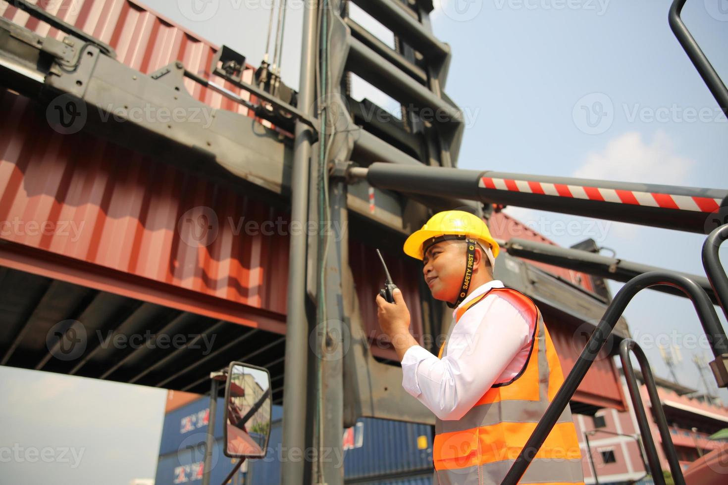 industry worker control loading containers in the container terminal photo