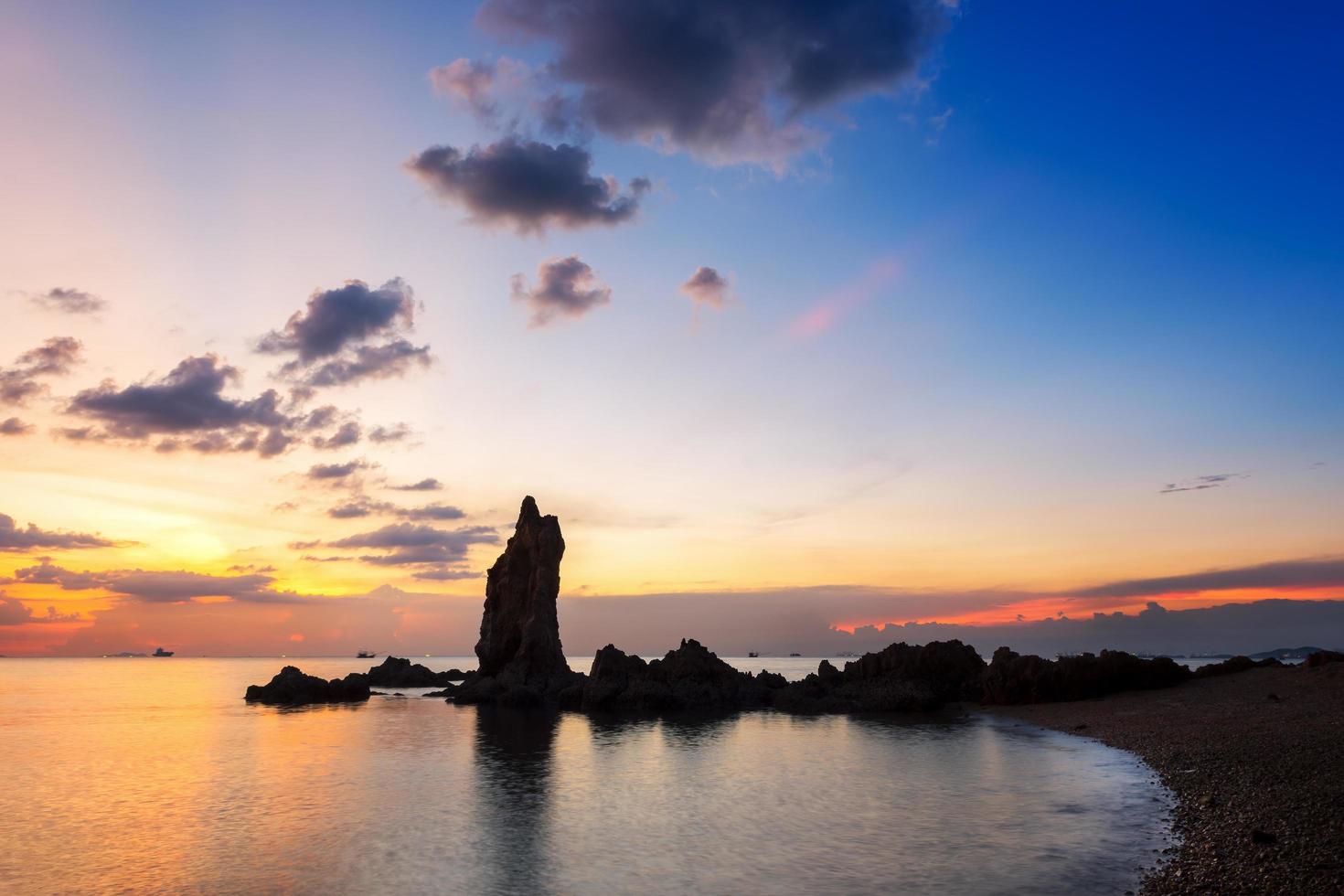 The view of the beautiful stone pillars in the middle of the sea, Chonburi province at sunset. photo