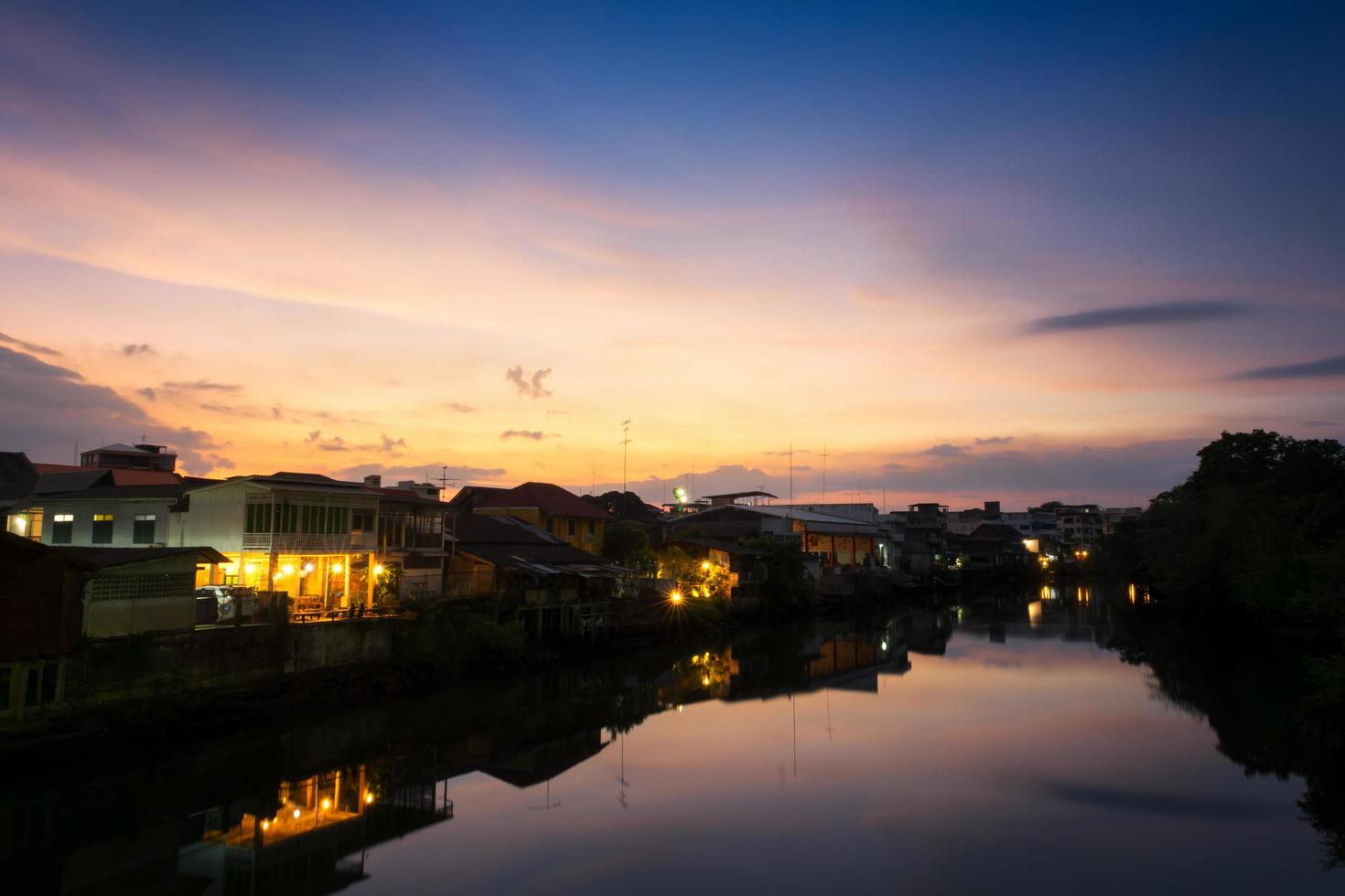 View of Chanthaboon River and riverside houses in Chanthaburi Province at sunset photo