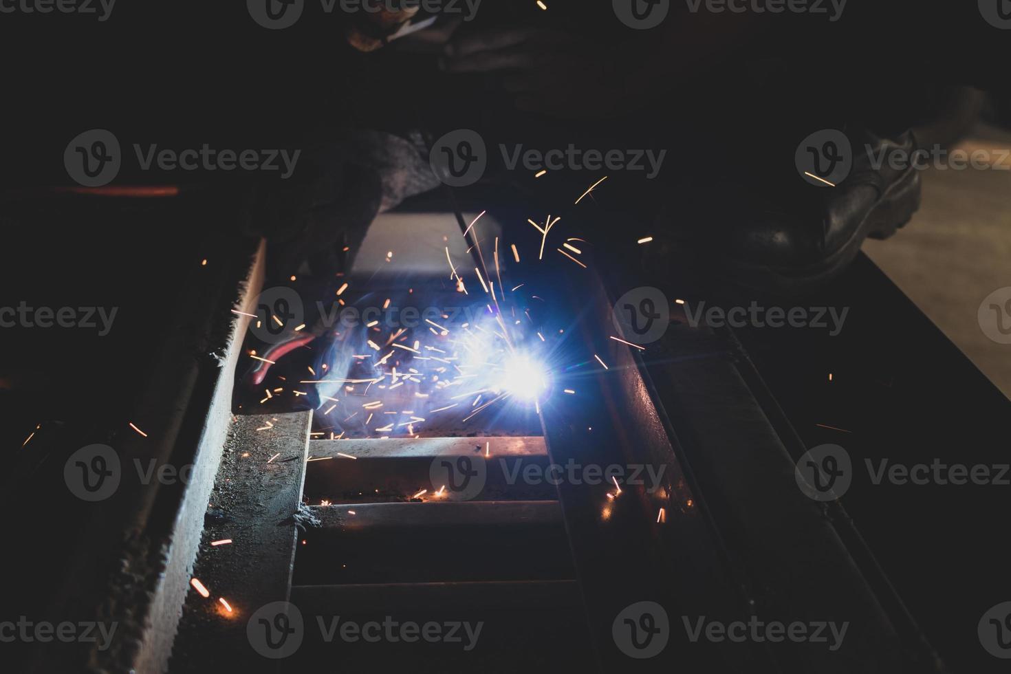 welder, welding automotive part in a car factory photo