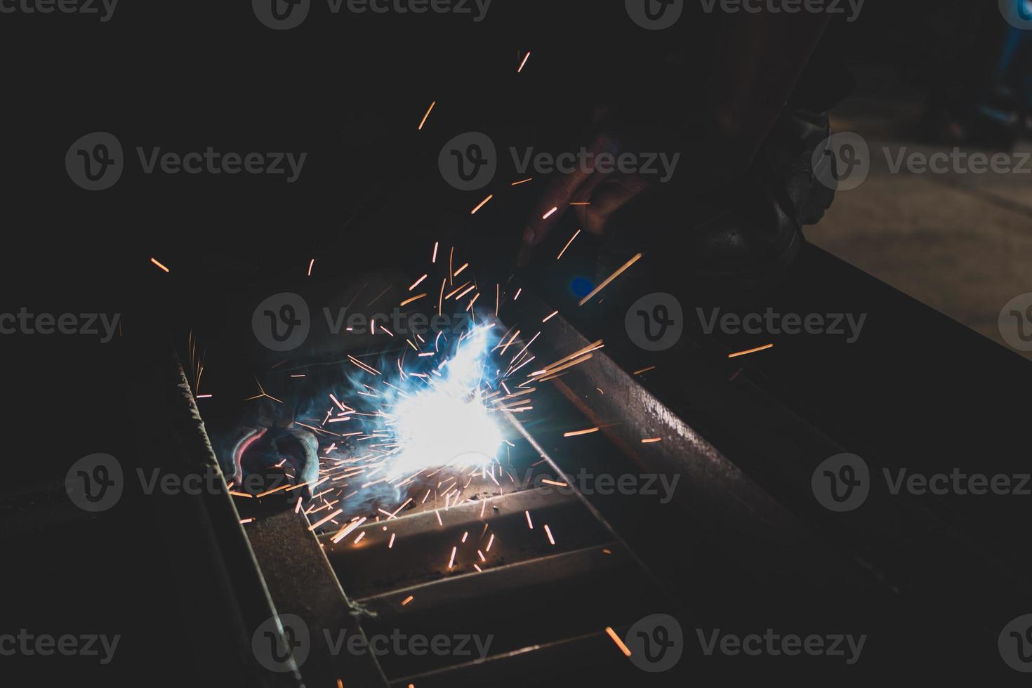 welder, welding automotive part in a car factory photo