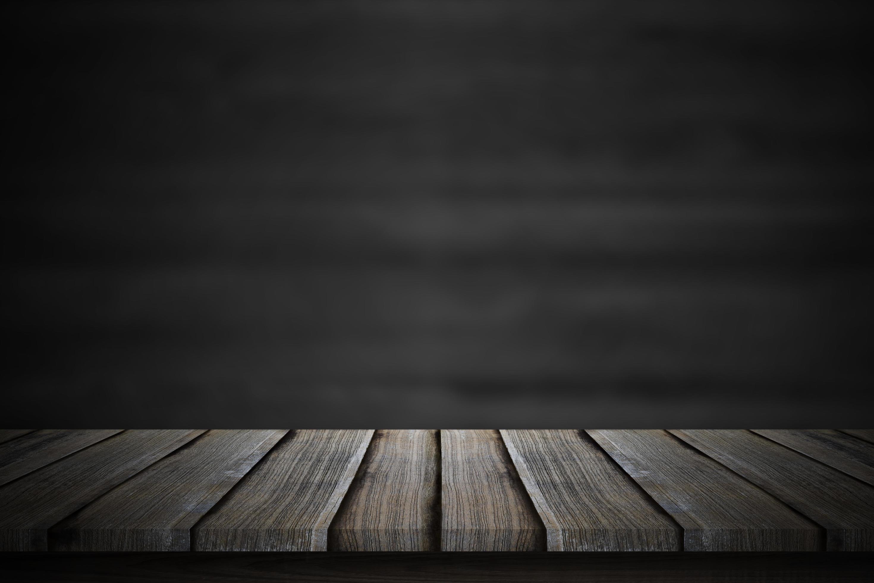 Empty wood table top over blur blackboard background. 7067601 Stock Photo  at Vecteezy