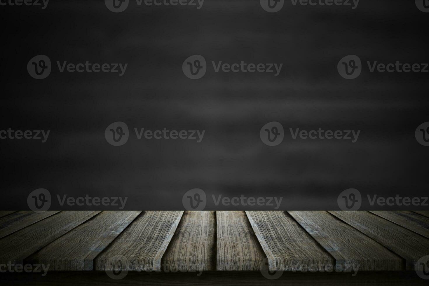 Empty wood table top over blur blackboard background. photo