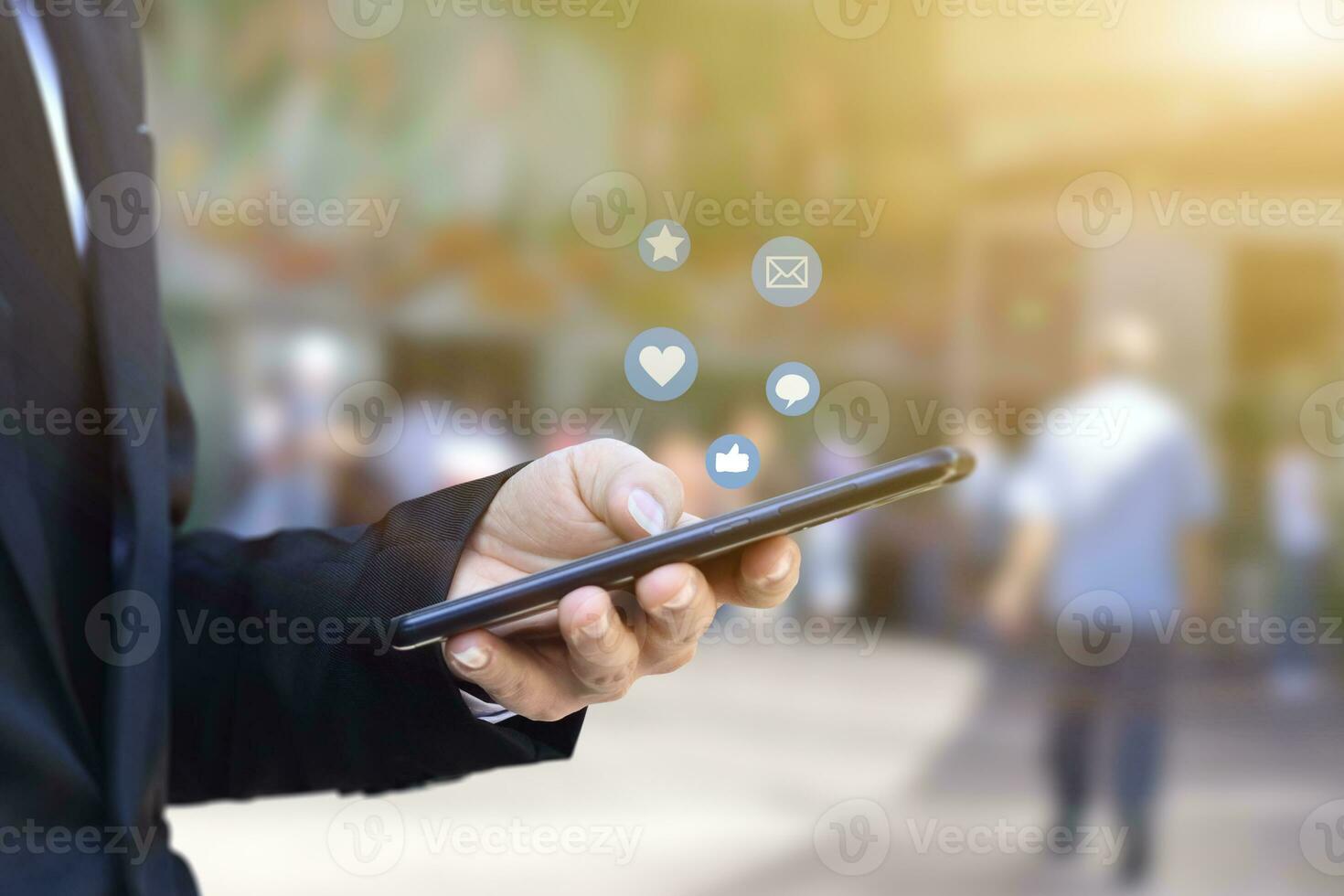 Close-up of businessman hands using mobile smartphone with social media icon. Idea for business, online marketing and technology. photo