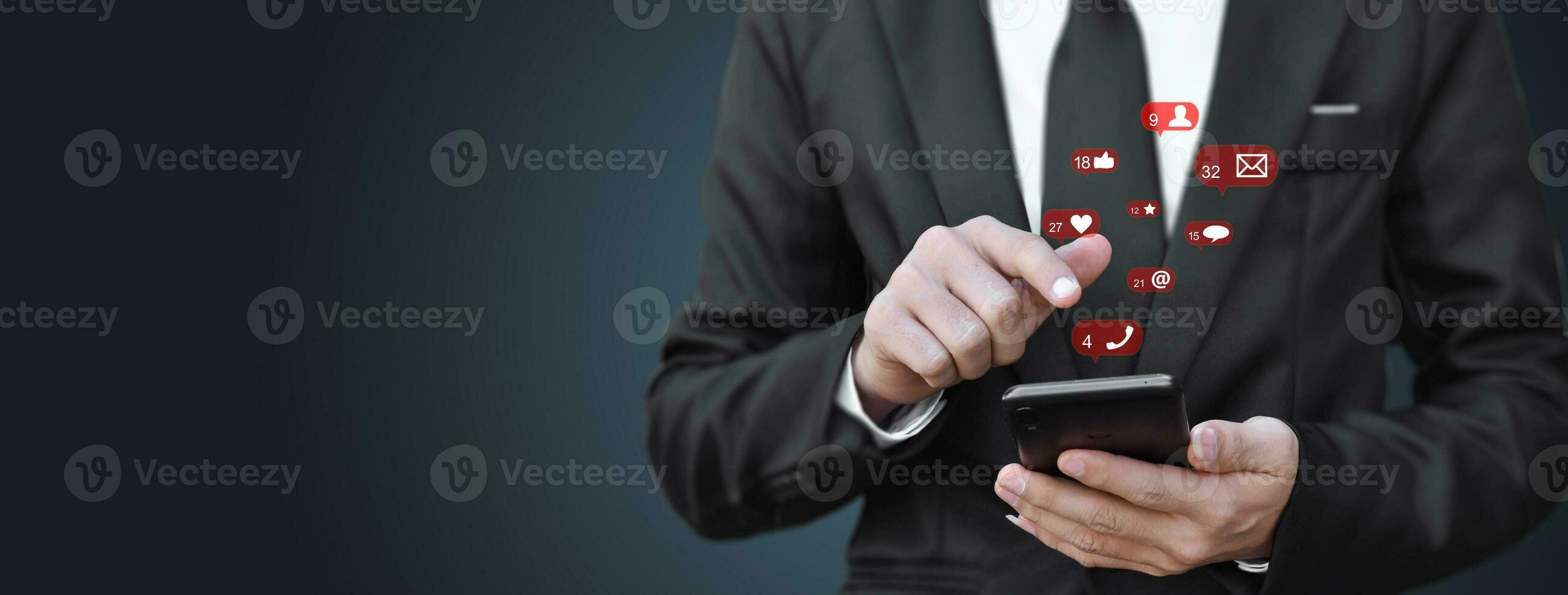 Close-up of businessman hands using mobile smartphone with social media icon. Idea for business, online marketing and technology. photo