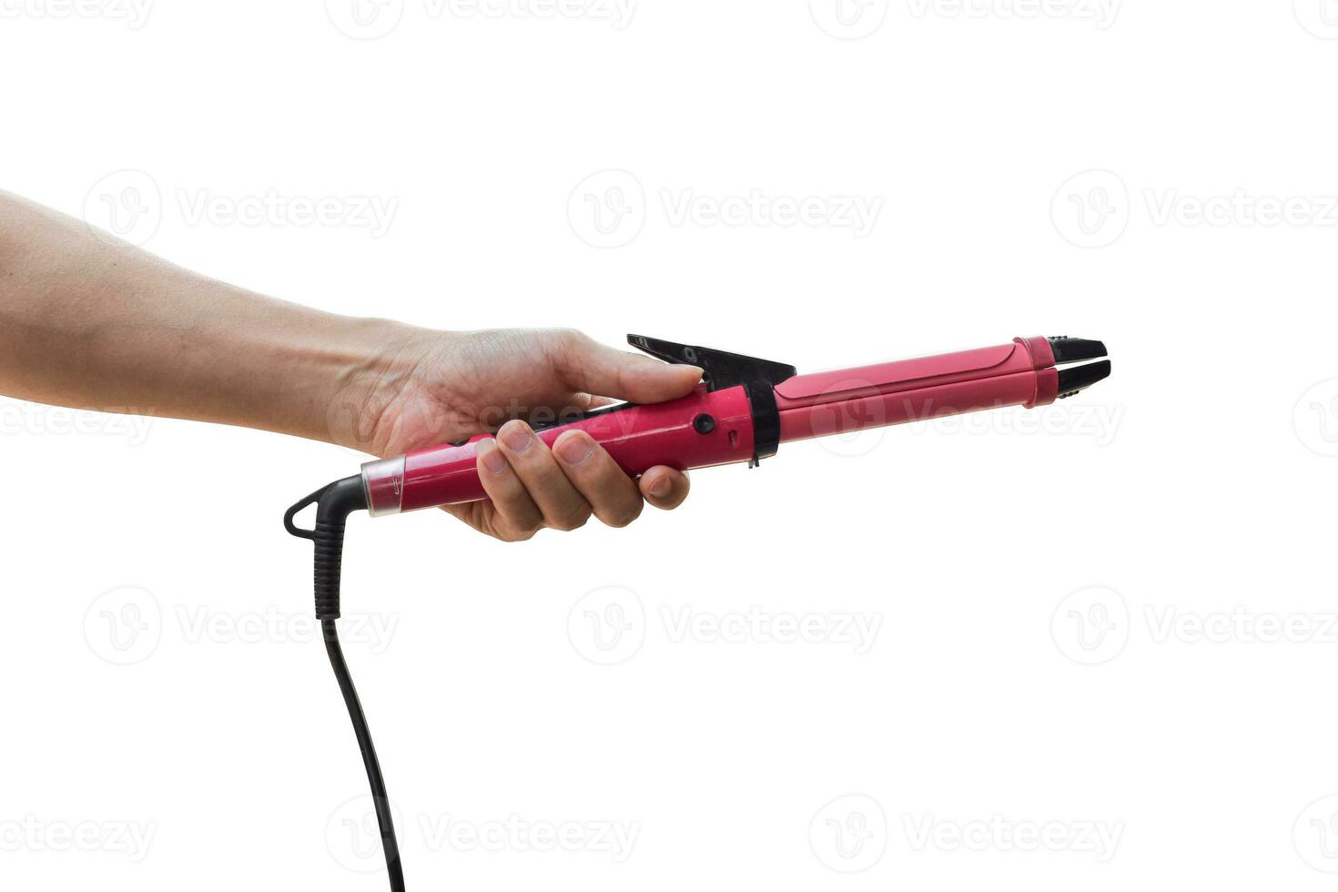 Hand holding curling iron isolated on white background. with clipping path. photo