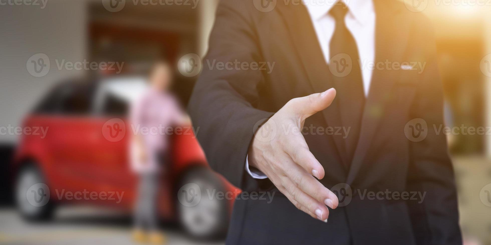 Businessman offering his hand for handshake in office. Concept of welcome for collaboration, introduction. Selective focus. photo