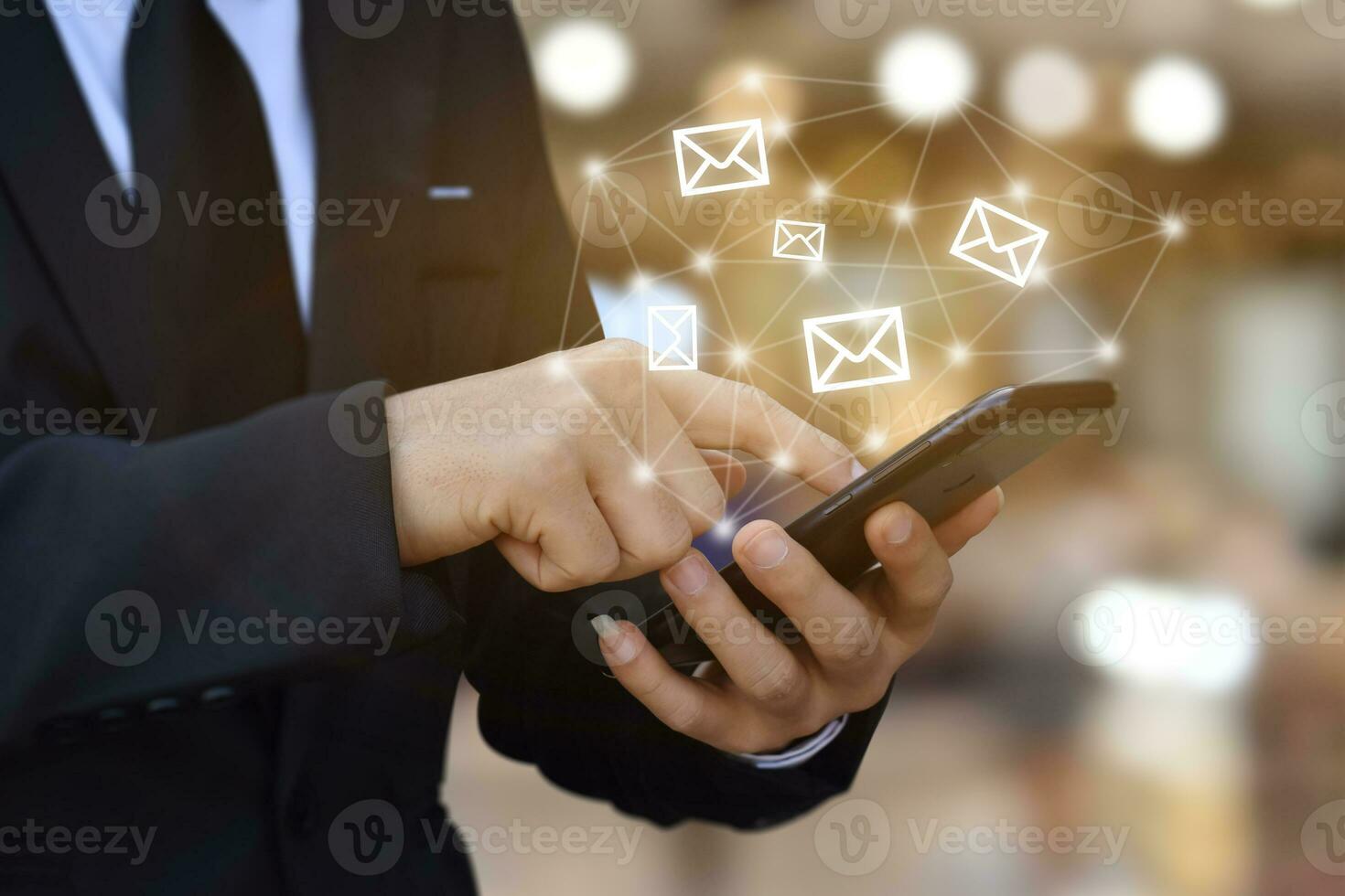 CONTACT US. Businessman hand using mobile smartphone with phone, mail, address. photo