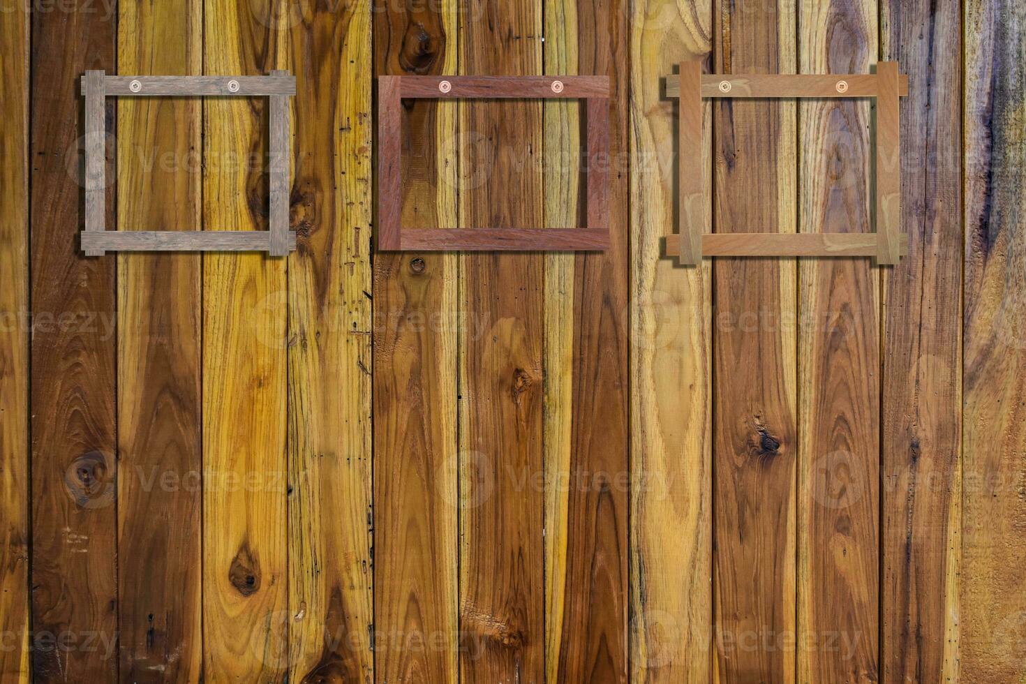 Old photo frames on wood wall. Wooden picture frame.