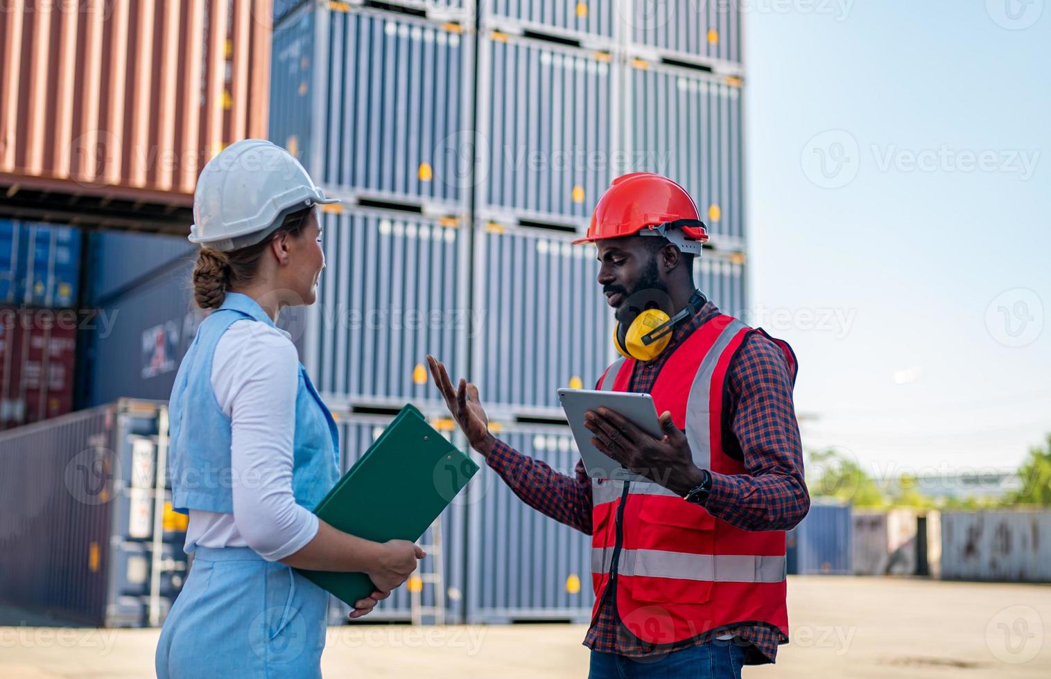 Foreman checking containers in the terminal, at import and export business logistic company. photo