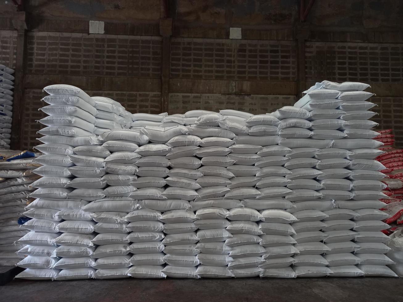 Chemical fertilizer The product stock is packed in sacks, stacked in the warehouse, waiting for delivery. photo