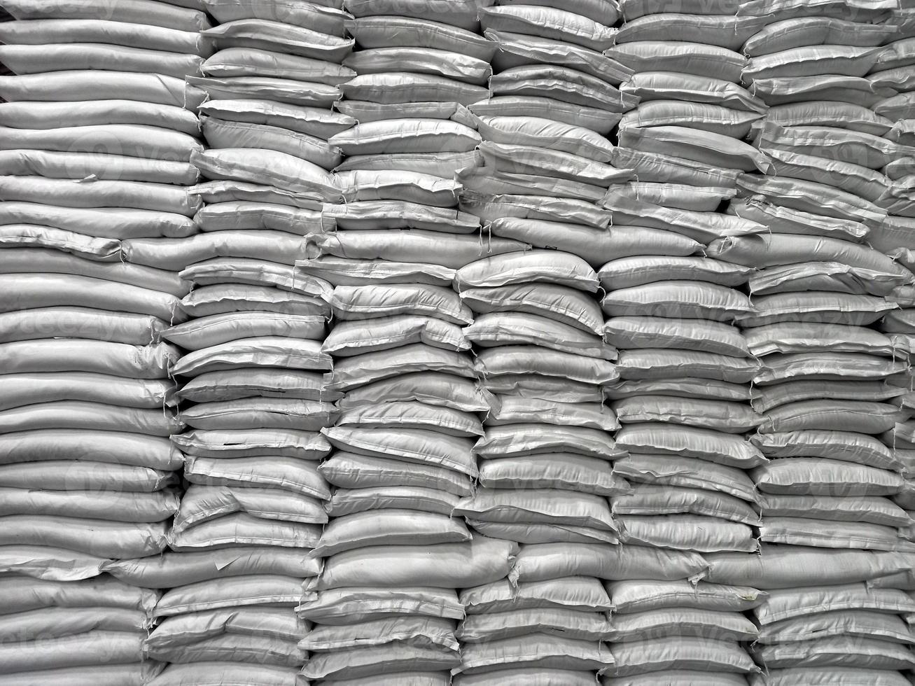 Chemical fertilizer The product stock is packed in sacks, stacked in the warehouse, waiting for delivery. photo