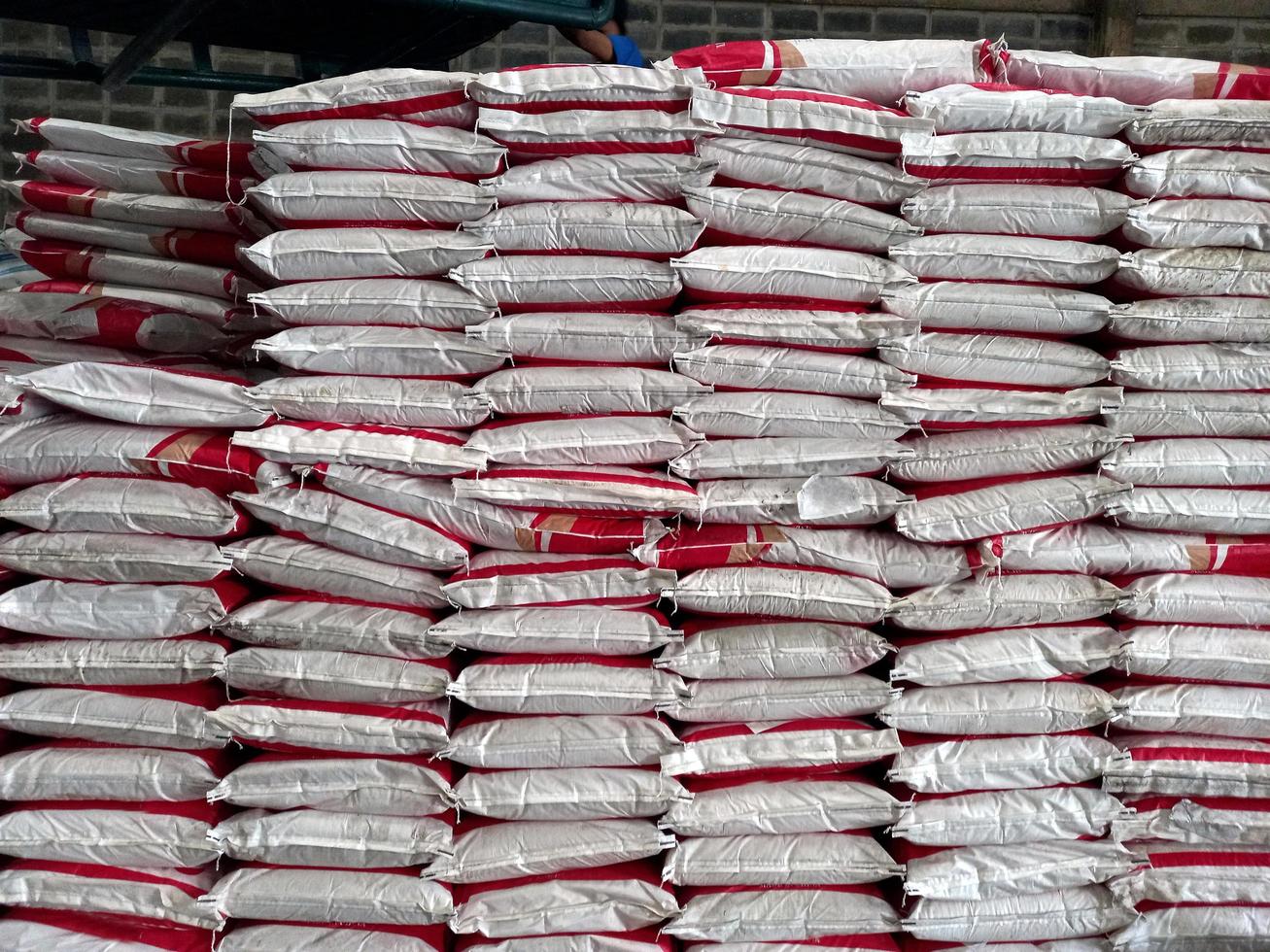 Large jumbo hemp sack White, packed with chemical fertilizer, rice, sugar, placed on a wooden pallet waiting to be delivered to the customer photo